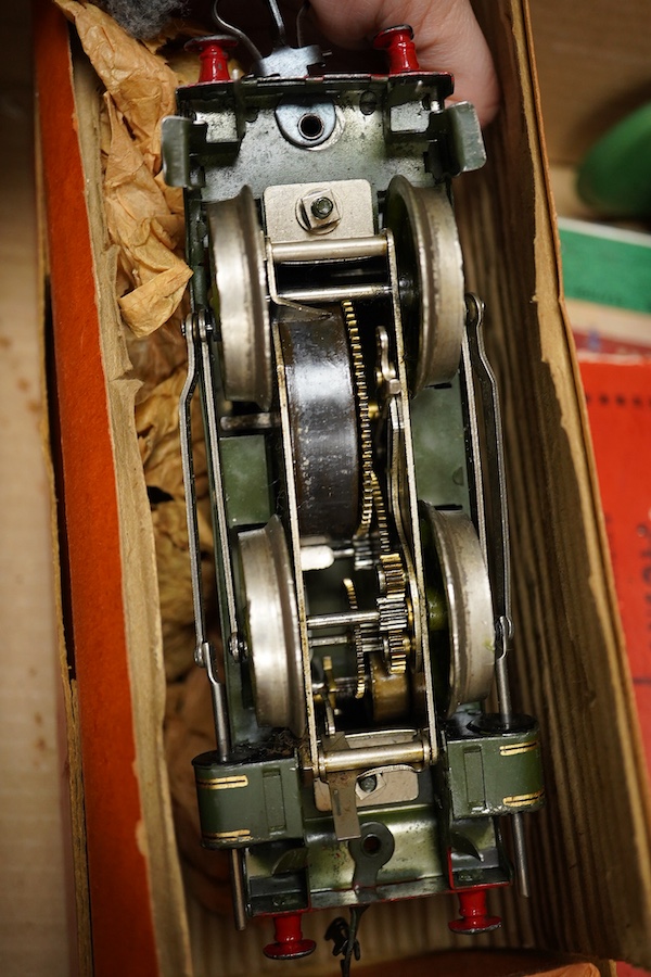 A collection of Hornby 0 gauge tinplate clockwork railway, including; a boxed No.1 Special GWR 0-4-0T locomotive, 5500, complete with original inner card packing pieces, etc., together with a boxed Dinky Toys No.1 Statio